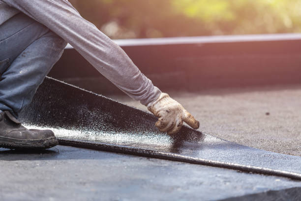 Professional Basement Waterproofing technician working in Medford, MA